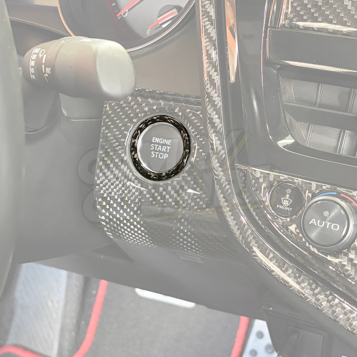 A Toyota Camry dash that highlights the carbon fiber ring surrounding the Engine Start Stop button. Made for the 2018, 2019, 2020, 2021, 2022, 2023, and 2024 Toyota Camry SE, XSE, LE, XLE, and TRD.
